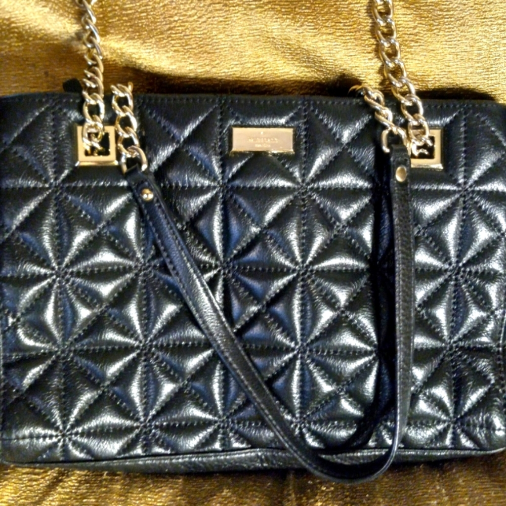 Kate Spade of New York.  Quilted cow leather in black shoulder bag.